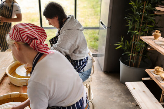 Women using potters wheels, Sweden