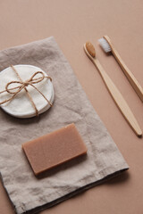 Fototapeta premium Wooden Toothbrush with Natural Soap and Sponge. Zero waste. Tooth Brushes Scattered on Table. Collection of Elegant Ecological Clear Healthcare Bath Accessory for Clean Teeth