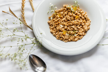 plate with breakfast on a white bed with flowers