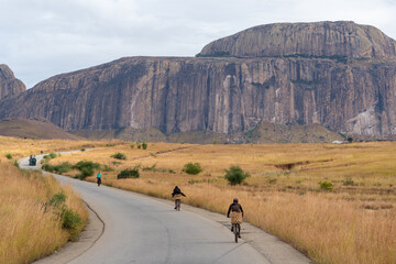 Cyclist on the road in Madagaskar - obrazy, fototapety, plakaty