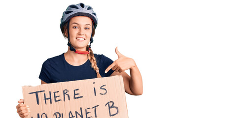 Beautiful caucasian woman holding there is no planet b banner smiling happy pointing with hand and...