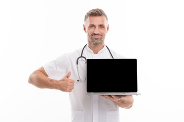 man therapist with laptop. medical worker with stethoscope show thumb up. technology in modern medicine. make an appointment with doctor online. physician consultation on covid. Your personal account