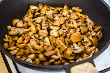Sauteed mushrooms in a frying pan