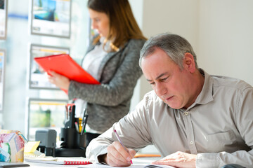 serious employee is reviewing documents