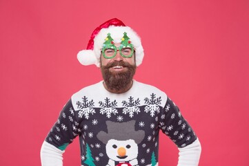 santa guy in hat and party glasses like his favorite winter sweater having fun on new year holiday, happy new year