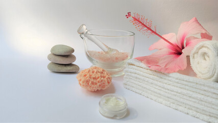 Spa setting and Spa background composition with hibiscus pink flower on white background. Banner. Copy space. © OLGA