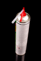 Polyurethane spray foam gun isolated on black