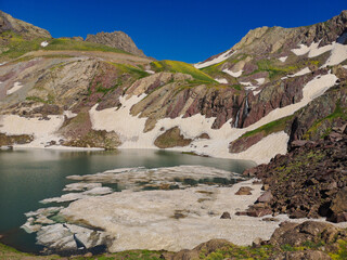 View of a lake in mountains. Hakkari cilo sat lakes, snowy mountains and natural scenery
