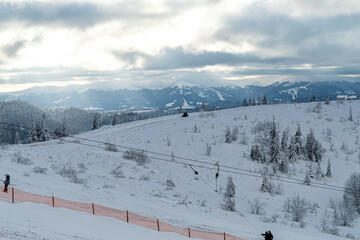 Skiing on mountain Zakhar Berkut, Carpathian mountains in Slavske, Ukraine on January 1, 2020. 