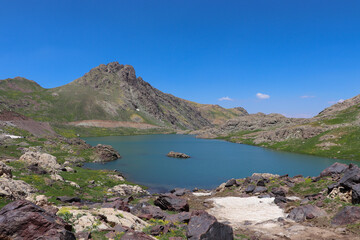View of a lake in mountains. Hakkari cilo sat lakes, snowy mountains and natural scenery
