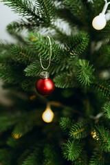 Beautiful Christmas tree with golden toys and garland lights. New Year and Christmas holidays.Closeup holiday and celebration  composition.