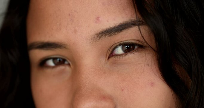 Macro close-up latina eyes sight looking at camera. casual real people series