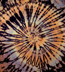 Reverse spiral tie dye in purple tan gray orange. Hippie tie-dye pattern texture background wallpaper.