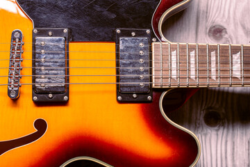 Sunburn semihollow vintage electric guitar close up still