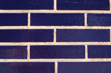 Fototapeta na wymiar Background of blue bricks with white lines 