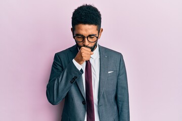 Handsome young hispanic man wearing business suit and tie shouting and screaming loud to side with hand on mouth. communication concept.