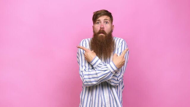 Young adult bearded caucasian man isolated points sideways, is trying to choose between two options