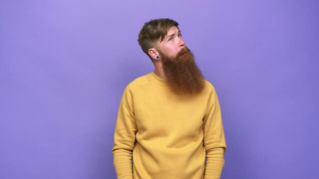 Young adult bearded caucasian man isolated confused, feels doubtful and unsure