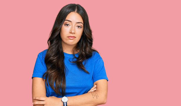 Beautiful brunette young woman wearing casual clothes looking sleepy and tired, exhausted for fatigue and hangover, lazy eyes in the morning.