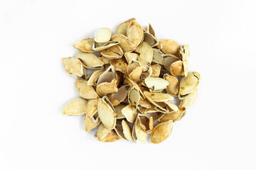 Pile of sunflower seeds isolated on white background. Stack of peeled skin
