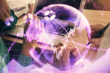 Double exposure of man and woman working together and forex chart hologram. Business concept. Computer background.
