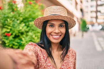 Young african american tourist woman on vacation smiling happy making selife by the camera at the city.