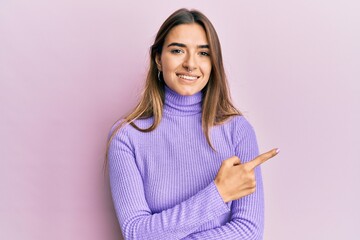 Young brunette woman with piercing wearing casual clothes surprised with hand on head for mistake,...