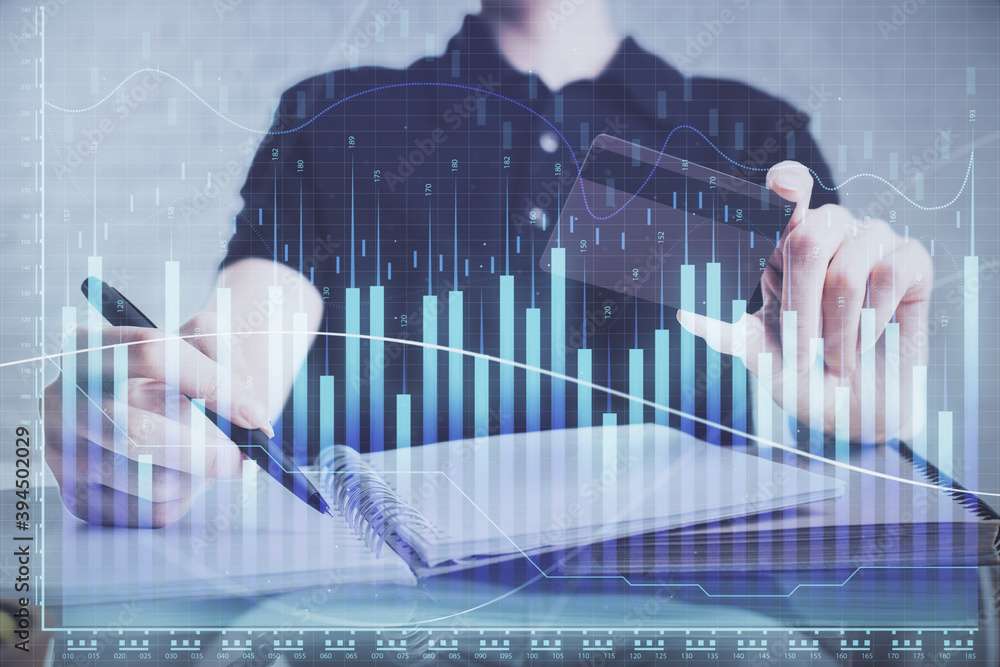Aufkleber double exposure of man hands holding a credit card and forex graph drawing. stock trading and digita