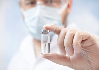 close up of a doctor holding a ampoule with anti covid-19 vaccine