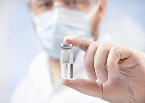 Close Up Of A Doctor Holding A Ampoule With Anti Covid-19 Vaccine