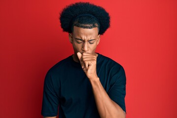Fototapeta na wymiar African american man with afro hair wearing casual clothes feeling unwell and coughing as symptom for cold or bronchitis. health care concept.
