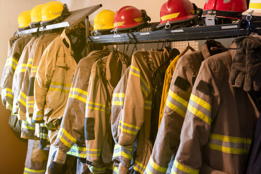 Firefighter's uniforms and gear arranged at fire station