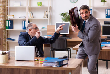 Two employees in pandemic concept at workplace