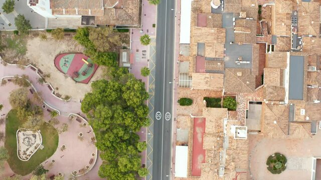 
Aerial view of the city during quarantine, covid - 19. Drone flight over the streets and houses where there are almost no people do not drive cars. Beautiful landscape of Mallorca Spain.