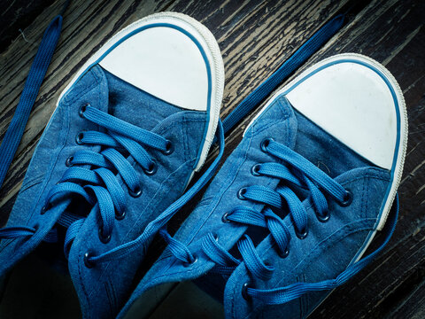 High Angle View Of Blue Shoes On Wood