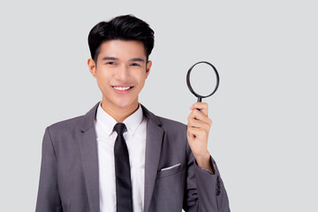 Young asian business man in suit look magnifying glass for search isolated on white background,...