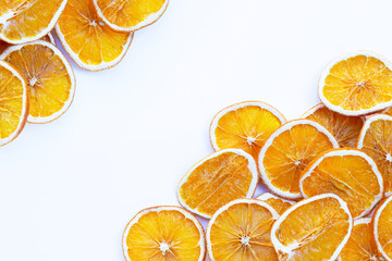 Dried orange slices on white background.