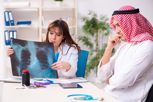 Young arab businessman visiting caucasian female doctor