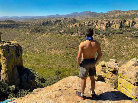 Young Man Triumphing In The Mountains. Conquering His Fears