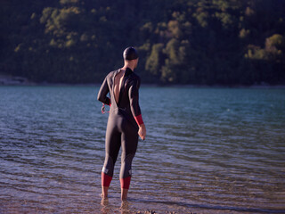 triathlete swimmer portrait wearing wetsuit on training