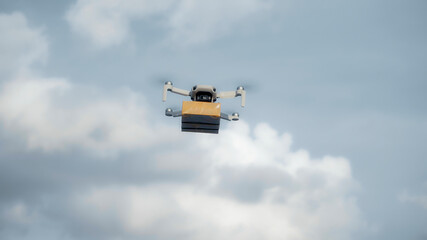 flying on a sky delivery drone with holding a .cardboard parcel