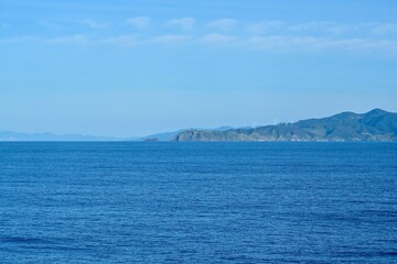 Fototapeta na wymiar 津軽海峡の船上から見る龍飛岬の情景＠青森県