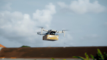 flying on a sky delivery drone with holding a .cardboard parcel