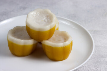 Kue Talam is an Indonesian traditional snack, made from sweet potatoes and thick coconut milk. Selective focus.