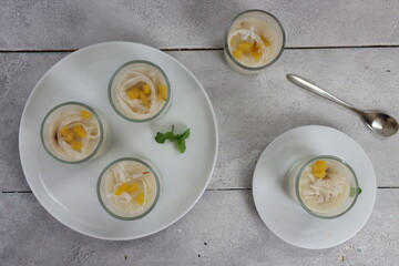 Puding es teler. Es teler Pudding made from young coconut, avocado and jack fruits with coconut milk.