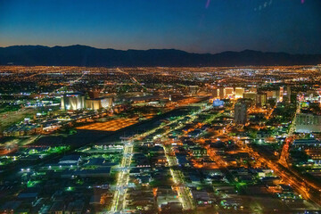 Fototapeta premium LAS VEGAS, NV - JUNE 29, 2018: Night aerial view of Casinos and Hotels along The Strip. This is the famous city road full of Casinos and Hotels