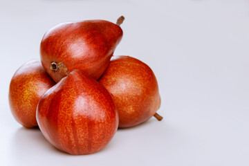 Shiny red pears isolated on white background.