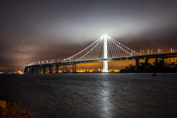 Bay Bridge at foggy night. San Francisco, California