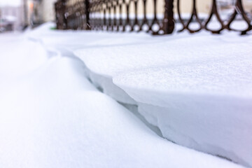 Deep snowdrift in the city. Abstract snow background