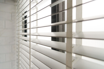 Close-up open venetian blinds. lighting range control sunlight coming from a window. decoration interior. Modern jalousie.